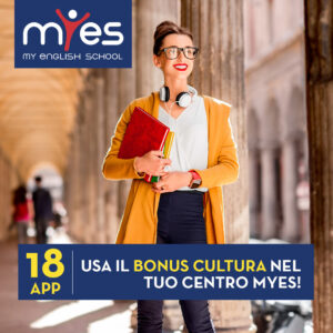 Portrait of a young female student dressed casually in the famous arched galleries in Bologna city in Italy. Bologna is student city and home to the oldest university in the world